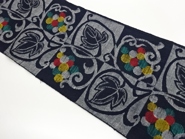 手織り真綿紬色紙に葡萄唐草模様織出し名古屋帯